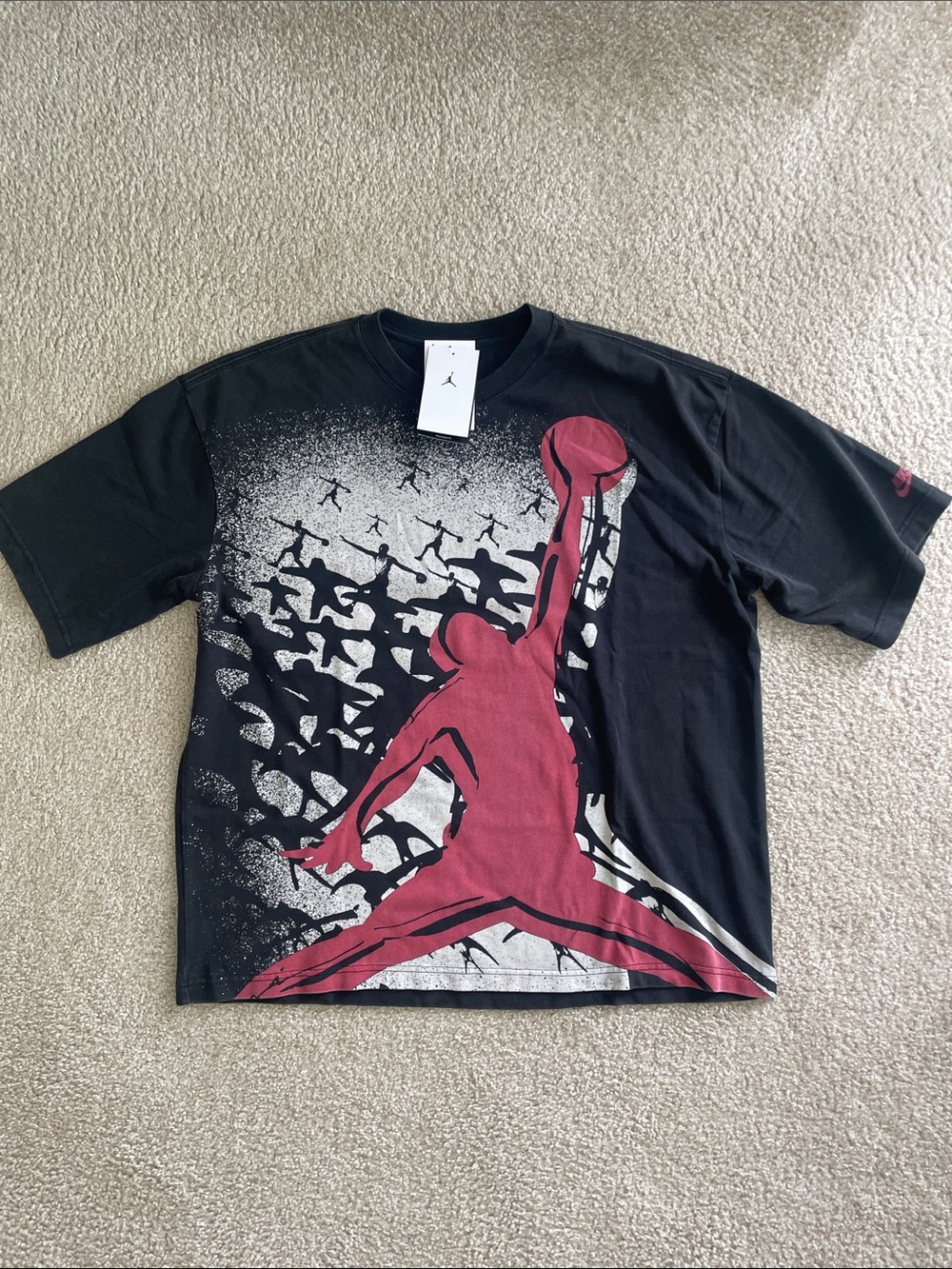 Nike Men's Black T-Shirt with Red Jumpman Graphic